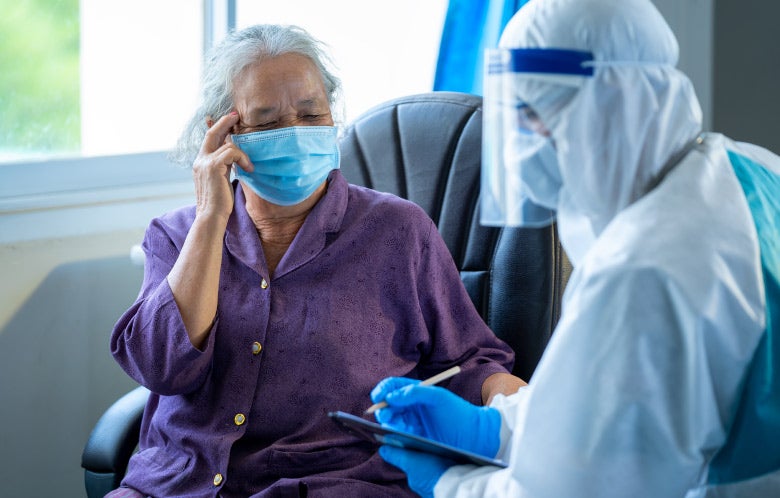 doctor checking in senior patient masks blog image template    