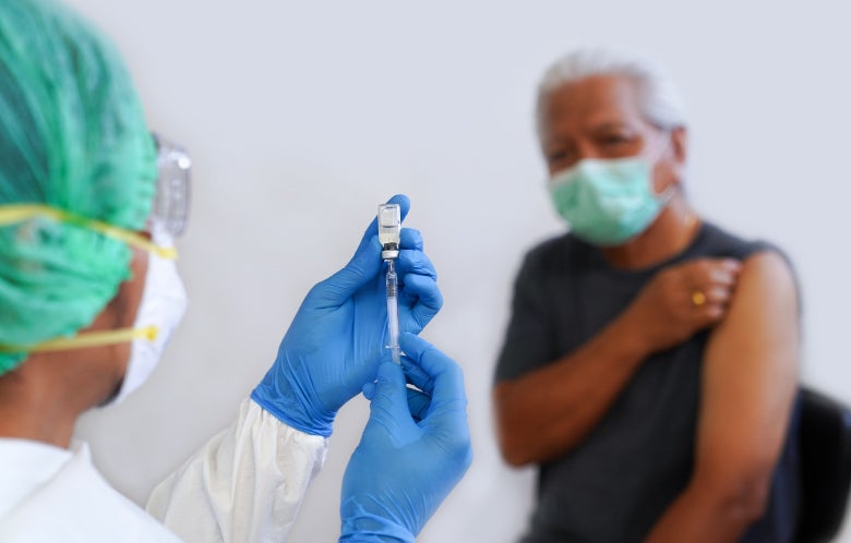 doctor prepping needle senior patient masks blog image template    