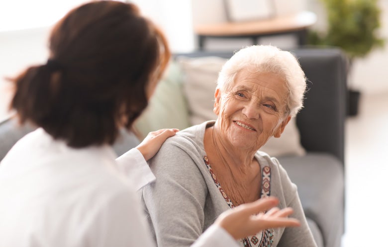 elderly patient comforted doctor blog image template    