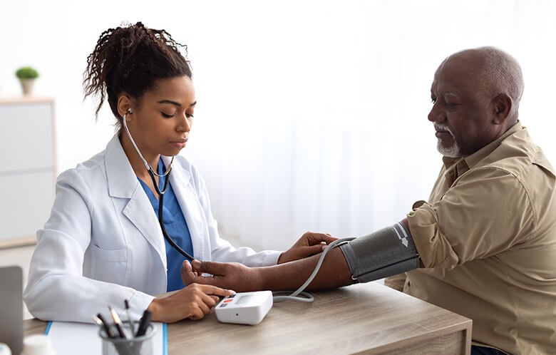 female doctor male patient blood pressure blog image    
