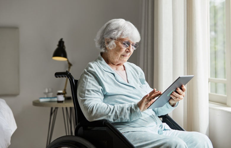 senior woman wheelchair tablet blog image template    